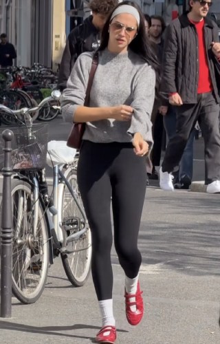 grey mock-neck sweater paired with classic black leggings