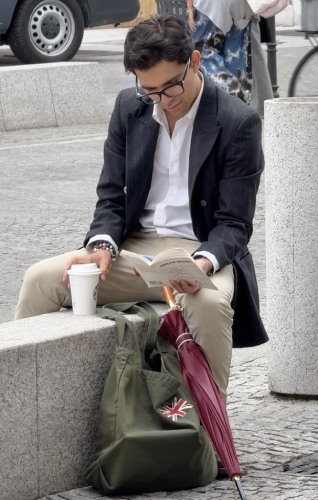 sharp pinstripe blazer paired with a crisp white button-down shirt tucked in